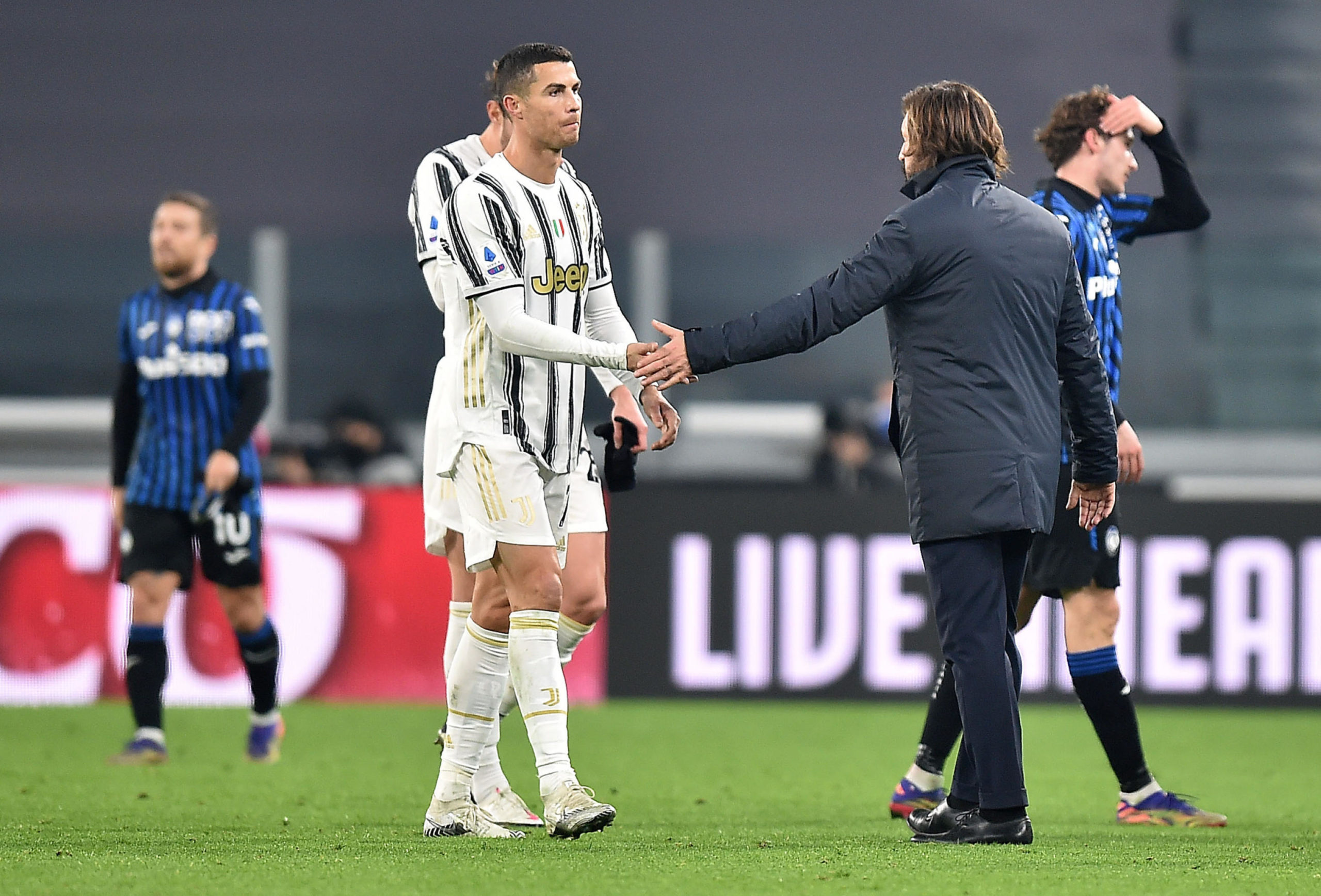 Cristiano Ronaldo and Andrea Pirlo at the end of Juventus' draw with Atalanta in December 2020