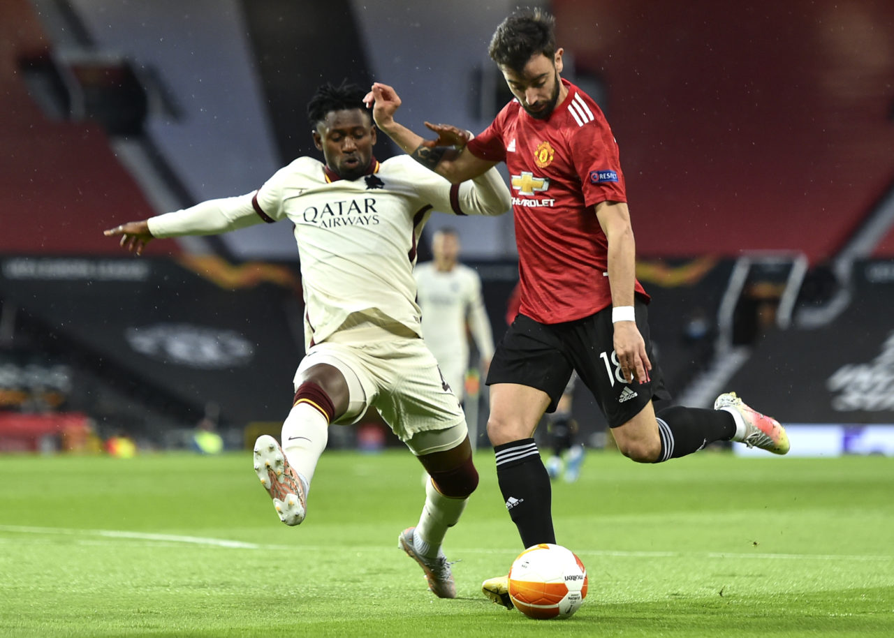 epa09168415 Bruno Fernandes (R) of Manchester United in action against Amadou Diawara (L) of Roma during the UEFA Europa League semi final, first leg soccer match between Manchester United and AS Roma at Old Trafford in Manchester, Britain, 29 April 2021. EPA-EFE/PETER POWELL