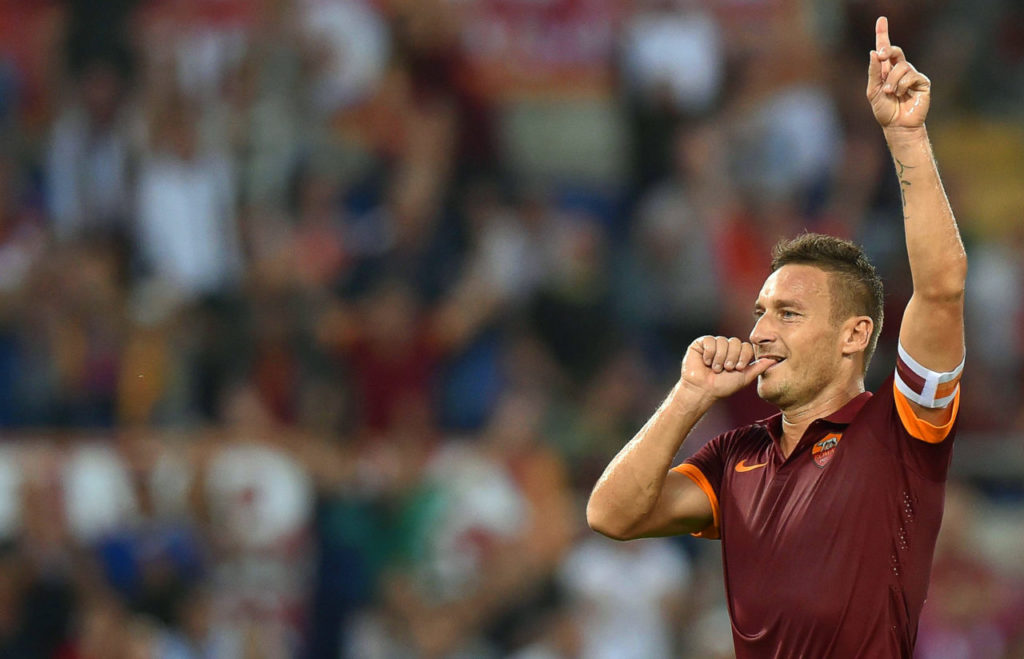 epa05942185 (FILE) Roma's Francesco Totti celebrates after scoring the 3-0 lead from the penalty spot during the Italian Serie A soccer match between AS Roma and AC Chievo Verona at the Olimpico stadium in Rome, Italy, 18 October 2014 (reissued 03 May 2017). Italian Serie A side AS Roma confirmed on 03 May 2017 that Roma legend Francesco Totti will retire at the end of the season. The 40-year-old scored 250 goals in 616 appearances for the Giallorossi since 1993 and won the FIFA World Cup in 2006. EPA/ETTORE FERRARI