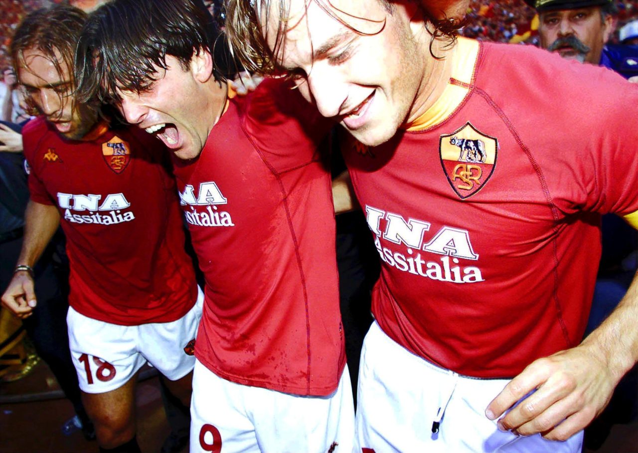 Gabriel Batistuta, Vincenzo Montella and Francesco Totti celebrate winning the Scudetto with Roma in 2001