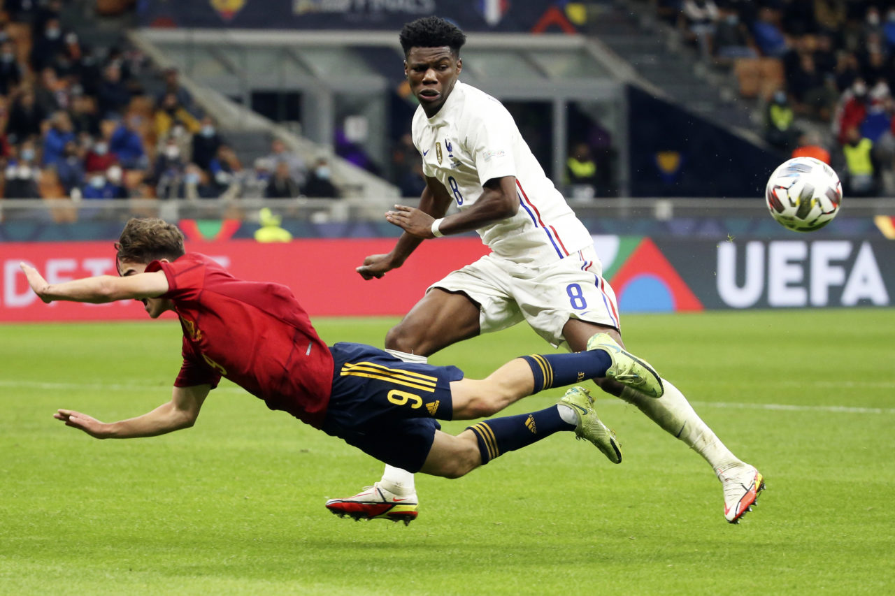 epa09517385 Spain's Gavi (L) in action against France's Aurelien Tchouameni (R) during the UEFA Nations League final soccer match between Spain and France in Milan, Italy, 10 October 2021. EPA-EFE/MATTEO BAZZI