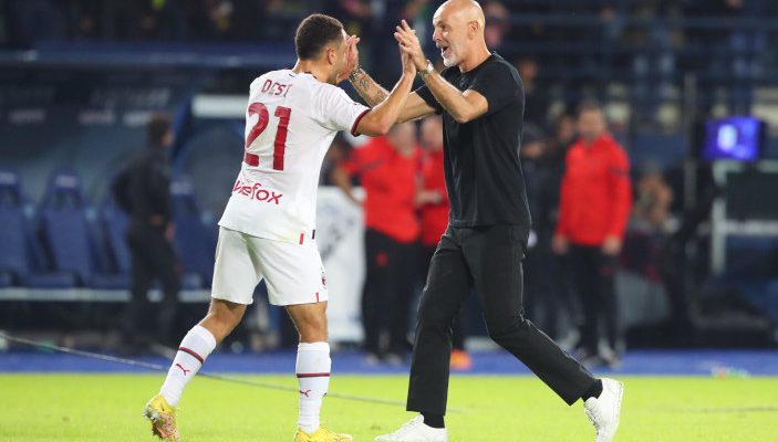 epa10218684 Milan's defender Sergino Dest (L) and Milan's coach Stefano Pioli (R) celebrate their win after the Italian Serie A soccer match between Empoli FC and AC Milan at Carlo Castellani stadium in Empoli, Italy, 01 October 2022. EPA-EFE/Claudio Giovannini