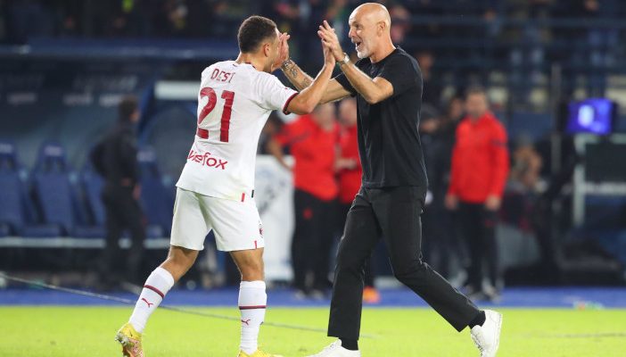 epa10218684 Milan's defender Sergino Dest (L) and Milan's coach Stefano Pioli (R) celebrate their win after the Italian Serie A soccer match between Empoli FC and AC Milan at Carlo Castellani stadium in Empoli, Italy, 01 October 2022. EPA-EFE/Claudio Giovannini